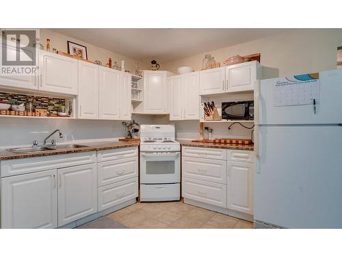 1 Bed Suite - Kitchen has Loads of Storage - 1811-1813 50 Avenue, Vernon, BC - Indoor Photo Showing Kitchen With Double Sink