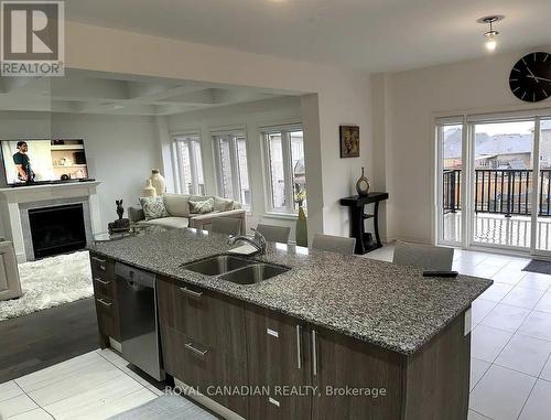 Upper - 105 Elephant Hill Drive, Clarington, ON - Indoor Photo Showing Kitchen With Fireplace With Double Sink