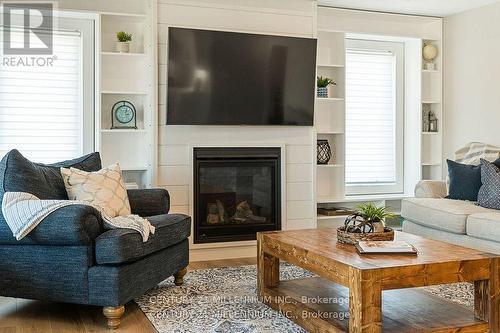 56 Mctavish Crescent, Huron-Kinloss, ON - Indoor Photo Showing Living Room With Fireplace