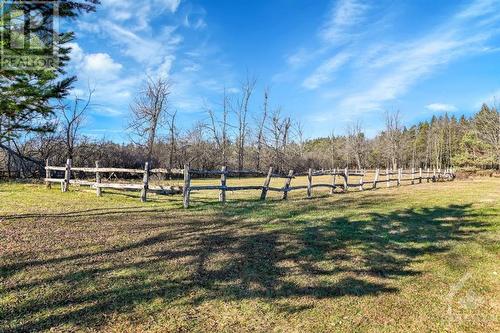 The fenced in paddocks near the barn. - 3161 Mackey Road, Manotick - Kars - Rideau Twp And Area (8008 - Rideau Twp S Of Reg Rd 6 W Of Mccordick Rd.), ON - Outdoor With View