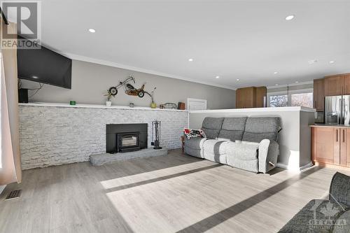 Your family and friends will be cozy gathered by the wood stove. - 3161 Mackey Road, Manotick - Kars - Rideau Twp And Area (8008 - Rideau Twp S Of Reg Rd 6 W Of Mccordick Rd.), ON - Indoor Photo Showing Other Room With Fireplace