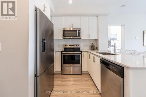 512 - 340 Plains Road, Burlington, ON - Indoor Photo Showing Kitchen With Double Sink