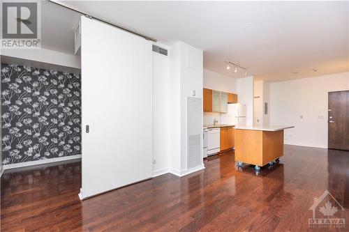 Moveable kitchen island offers flexibility and extra space for culinary adventures. - 383 Cumberland Street Unit#710, Ottawa, ON - Indoor Photo Showing Kitchen