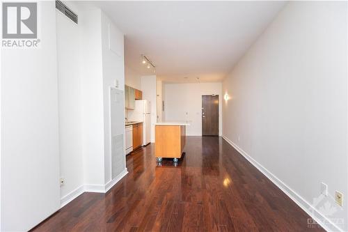 Hardwood floors lend warmth and elegance to every room in the condo. - 383 Cumberland Street Unit#710, Ottawa, ON - Indoor Photo Showing Other Room