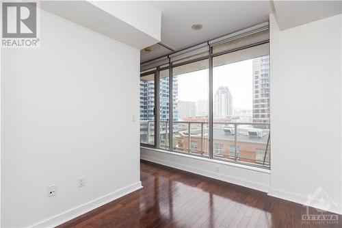 Combining urban style with comfort, this 1-bed, 1-bath condo features rich hardwood floors and a convenient moveable kitchen island. - 383 Cumberland Street Unit#710, Ottawa, ON - Indoor Photo Showing Other Room