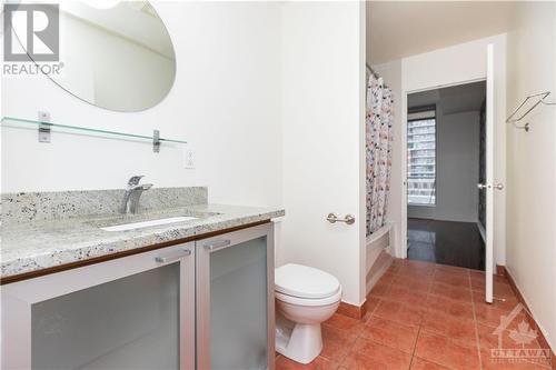 Experience convenience and style with granite kitchen counters, high ceilings, and unbeatable Byward Market access in this beautiful condo. - 383 Cumberland Street Unit#710, Ottawa, ON - Indoor Photo Showing Bathroom