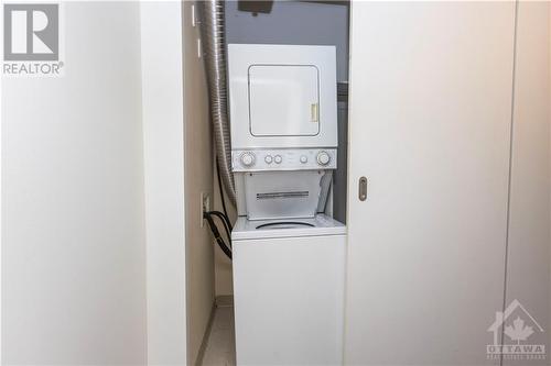 With rich hardwood floors and a versatile kitchen layout, this condo offers modern style and unbeatable access to downtown amenities. - 383 Cumberland Street Unit#710, Ottawa, ON - Indoor Photo Showing Laundry Room