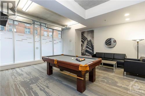 Step into a beautiful condo with a front-row seat to the downtown with amenities like a gym, BBQ area, and meeting room. - 383 Cumberland Street Unit#710, Ottawa, ON - Indoor Photo Showing Other Room