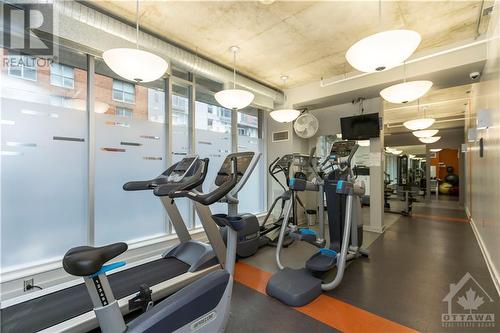 Find balance in a building equipped with a gym, meeting room, and outdoor amenities. - 383 Cumberland Street Unit#710, Ottawa, ON - Indoor Photo Showing Gym Room