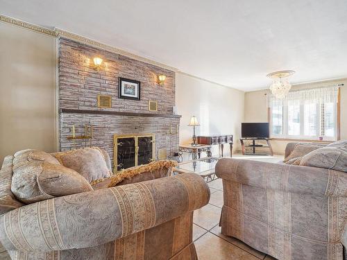 Salon - 8731 Av. René-Descartes, Montréal (Rivière-Des-Prairies/Pointe-Aux-Trembles), QC - Indoor Photo Showing Living Room With Fireplace