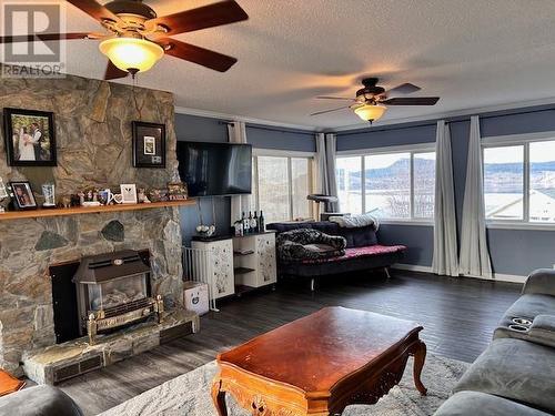 240 Carrier Crescent, Fraser Lake, BC - Indoor Photo Showing Living Room With Fireplace