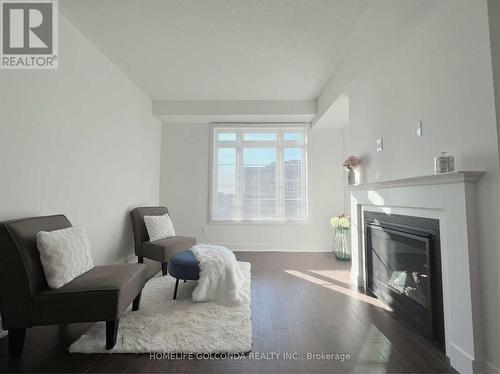 11 Elkington Crescent, Whitby, ON - Indoor Photo Showing Living Room With Fireplace