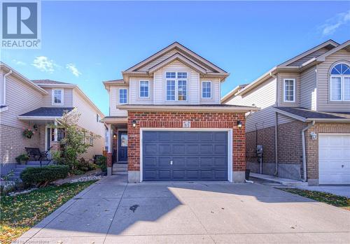 View of front of home with a garage - 83 Bridlewreath Street, Kitchener, ON - Outdoor With Facade