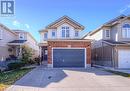 View of front of home with a garage - 83 Bridlewreath Street, Kitchener, ON  - Outdoor With Facade 