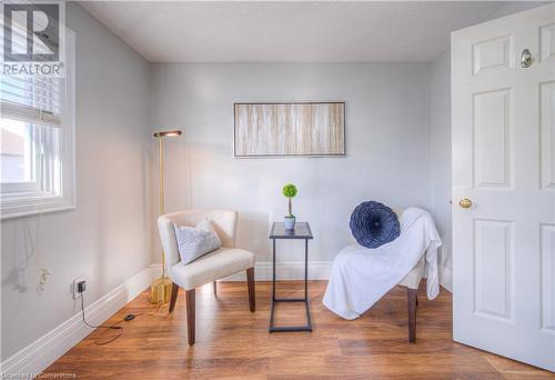 Living area featuring wood-type flooring - 83 Bridlewreath Street, Kitchener, ON - Indoor