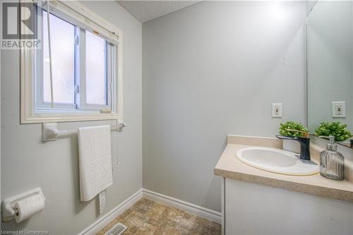 Bathroom with vanity and a textured ceiling - 83 Bridlewreath Street, Kitchener, ON - Indoor Photo Showing Bathroom