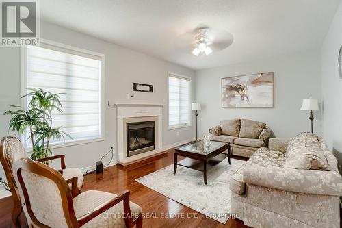 33 Huntspoint Drive, Brampton, ON - Indoor Photo Showing Living Room With Fireplace