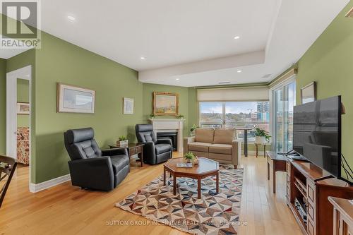 609 - 6 Toronto Street, Barrie, ON - Indoor Photo Showing Living Room With Fireplace