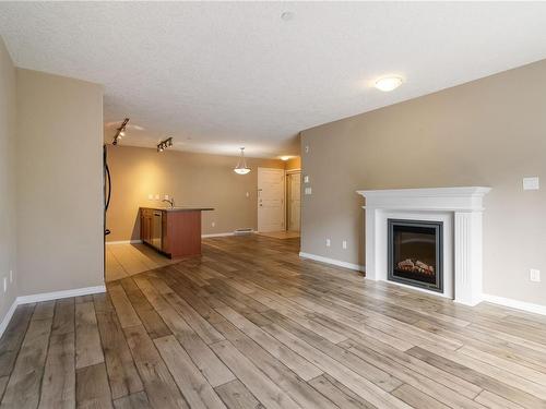 204-2823 Jacklin Rd, Langford, BC - Indoor Photo Showing Living Room With Fireplace