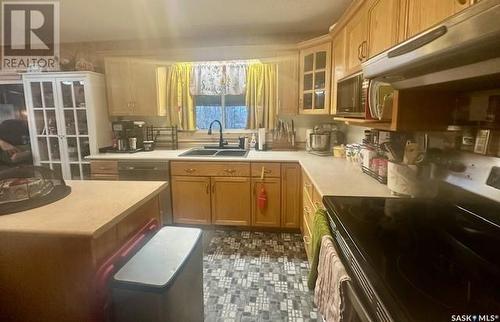 1515 Laronge Avenue, La Ronge, SK - Indoor Photo Showing Kitchen With Double Sink