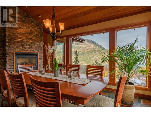 1630 Knox Road, Nelson, BC - Indoor Photo Showing Dining Room With Fireplace