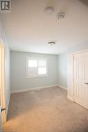 Carpeted spare room with a textured ceiling - 