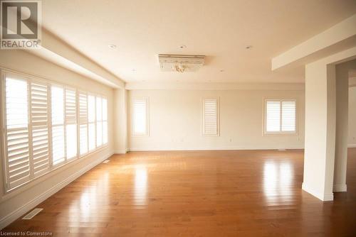 Unfurnished room with a wealth of natural light and wood-type flooring - 839 Autumn Willow Drive, Waterloo, ON - Indoor Photo Showing Other Room