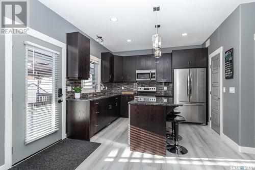 214 Bentley Court, Saskatoon, SK - Indoor Photo Showing Kitchen With Stainless Steel Kitchen With Upgraded Kitchen