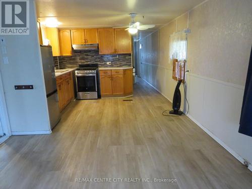 Laminate floors - 102 - 2189 Dundas Street E, London, ON - Indoor Photo Showing Kitchen