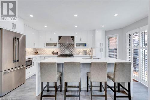 Kitchen featuring white cabinets, stainless steel appliances, wall chimney exhaust hood, and sink - 139 Shady Pine Circle, Brampton, ON - Indoor Photo Showing Kitchen With Upgraded Kitchen