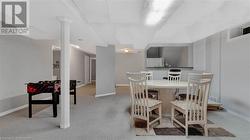 Dining room with light colored carpet - 