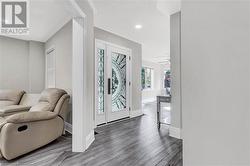 Foyer featuring hardwood / wood-style flooring and ceiling fan - 