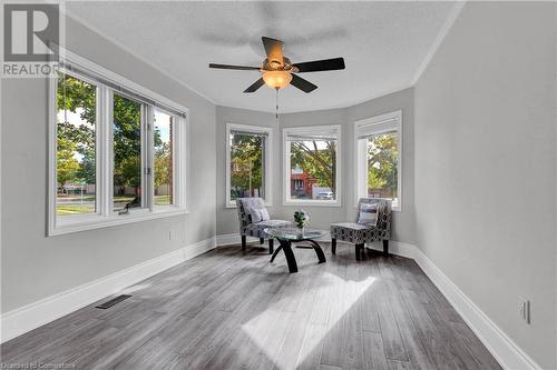 Living area with a textured ceiling, hardwood / wood-style flooring, and ceiling fan - 139 Shady Pine Circle, Brampton, ON - Indoor