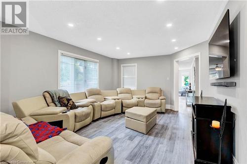 Living room featuring a textured ceiling and light wood-type flooring - 139 Shady Pine Circle, Brampton, ON - Indoor Photo Showing Living Room