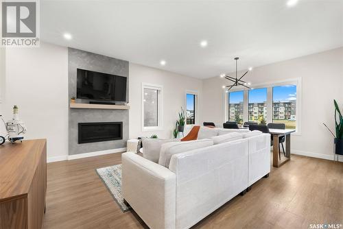 5217 E Green Crescent, Regina, SK - Indoor Photo Showing Living Room With Fireplace