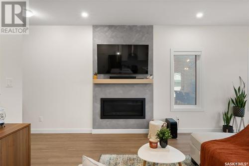 5217 E Green Crescent, Regina, SK - Indoor Photo Showing Living Room With Fireplace