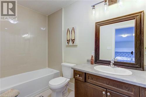 Full bathroom with vanity, tiled shower / bath combo, and toilet - 135 Samuel Drive, Arthur, ON 