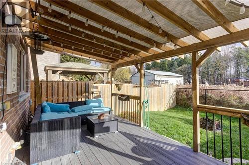 Deck featuring an outdoor hangout area and a lawn - 135 Samuel Drive, Arthur, ON 