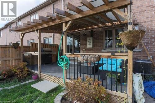 Wooden terrace featuring central air condition unit, an outdoor living space, a pergola, and grilling area - 135 Samuel Drive, Arthur, ON 