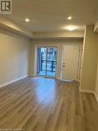 Entrance foyer with light hardwood / wood-style floors - 