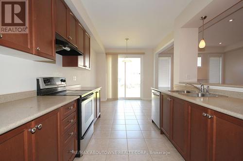 24 - 2019 Trawden Way, Oakville, ON - Indoor Photo Showing Kitchen With Double Sink