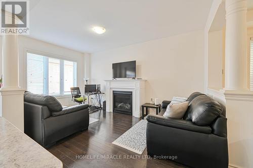 34 Pearman Crescent, Brampton, ON - Indoor Photo Showing Living Room With Fireplace