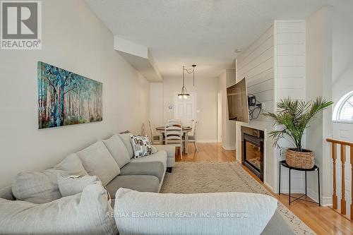 59 - 1169 Dorval Drive, Oakville, ON - Indoor Photo Showing Living Room With Fireplace