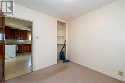 Carpeted empty room with ceiling fan - 