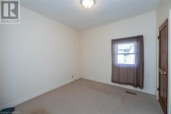 Unfurnished room with light colored carpet - 