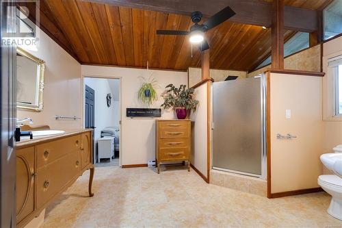 Upstairs bathroom with antique vanity, large walk-in shower with a double head shower. - 724 Nancy Greene Dr, Campbell River, BC 