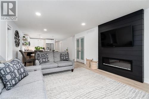 view of great room and double door pantry - 118 Shady Hill Road, Durham, ON - Indoor Photo Showing Living Room With Fireplace