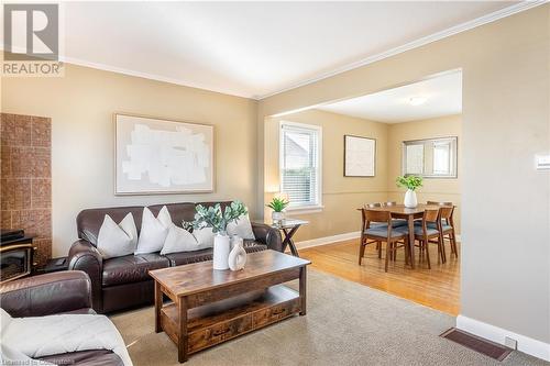 Living room with light wood-type flooring and crown molding - 645 Weber Street E, Kitchener, ON - Indoor Photo Showing Living Room