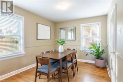 Dining room featuring light wood-type flooring - 