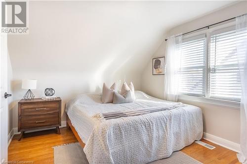 Bedroom featuring multiple windows, vaulted ceiling, and light hardwood / wood-style flooring - 645 Weber Street E, Kitchener, ON - Indoor Photo Showing Bedroom